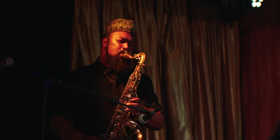 Male saxophone player performs alone