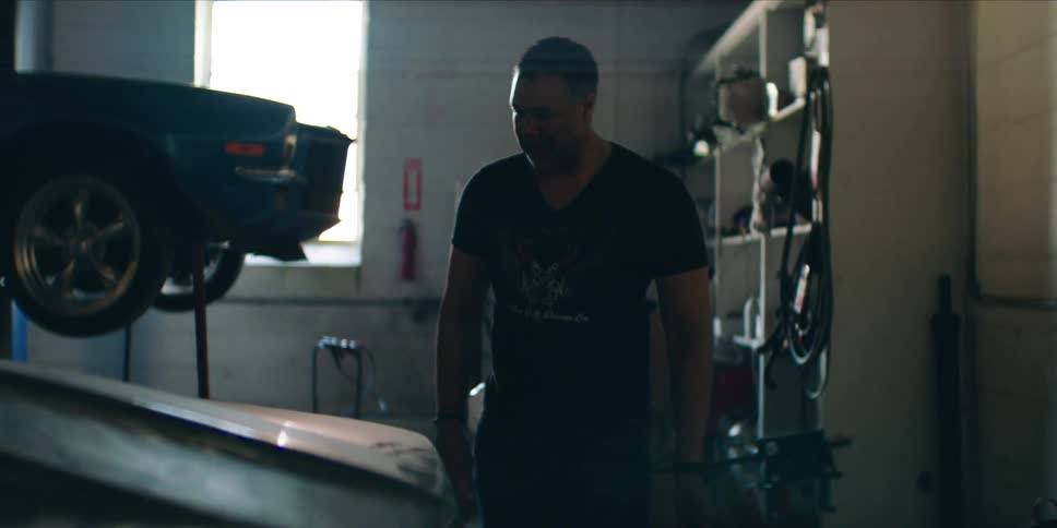 Mechanic checking a car in a workshop