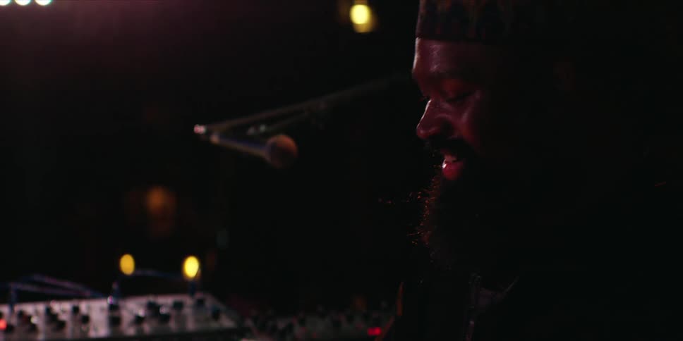 A man playing a musical instrument on a stage