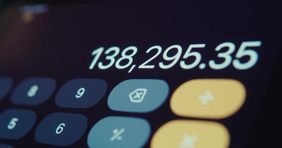 A digital calculators screen displays numbers being added along with several blue and yellow buttons