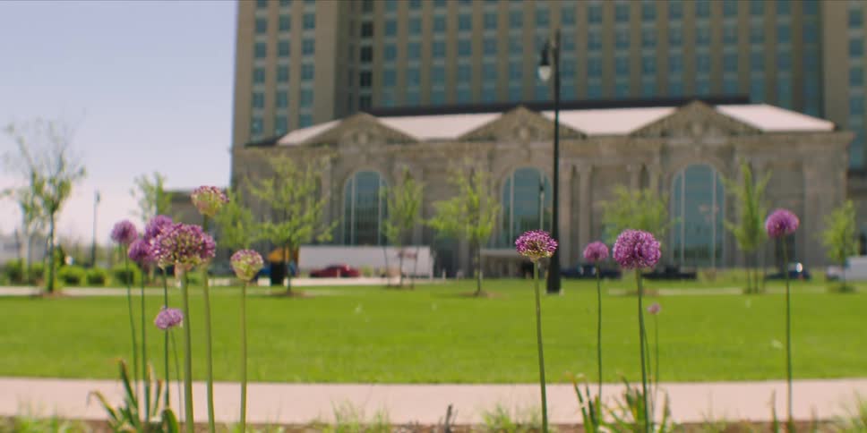 A large building is shown in the distance