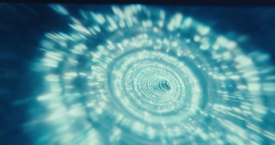 Spots of light form rings on the walls of a tunnel
