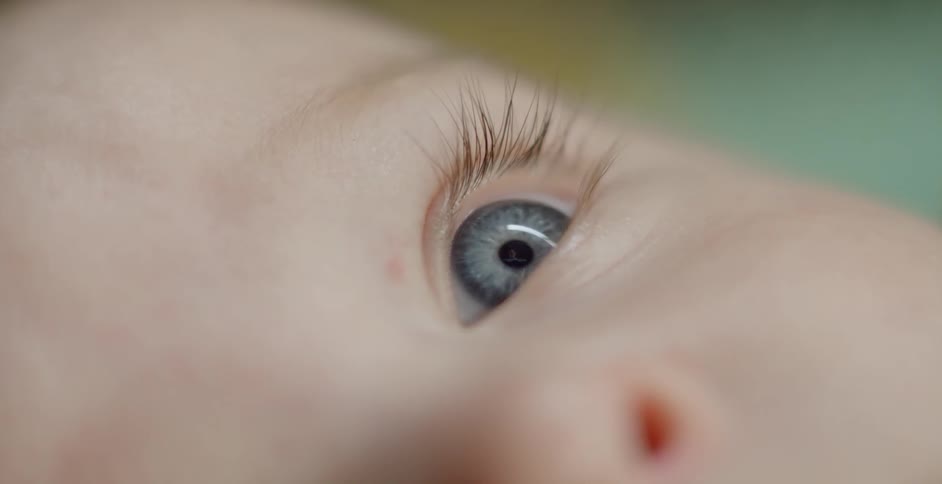 A blue eyed baby stares out