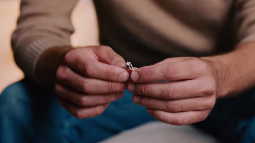 Man holding a diamond ring starts to shake