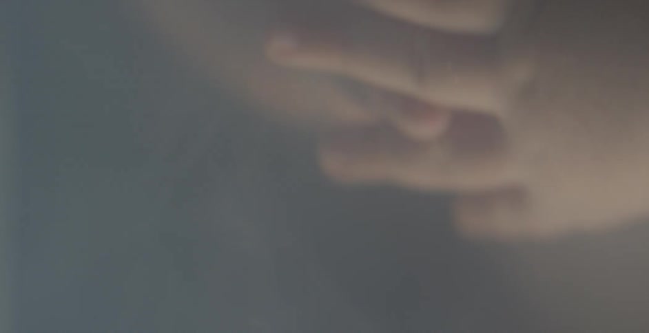 A baby's hands are moving