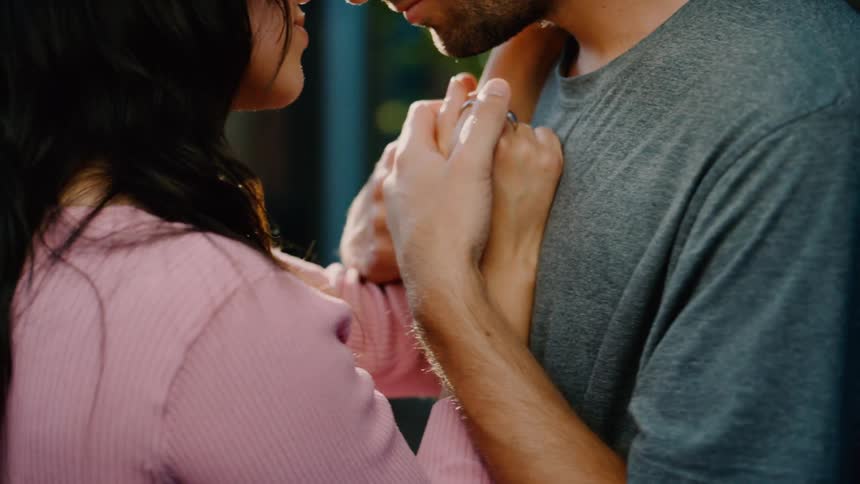 A couple dance while holding hands
