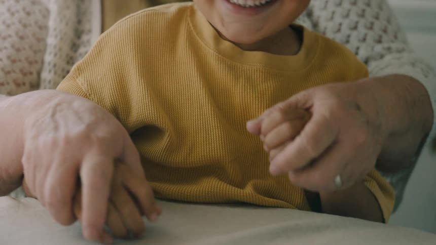 A grandmother has fun with her grandson
