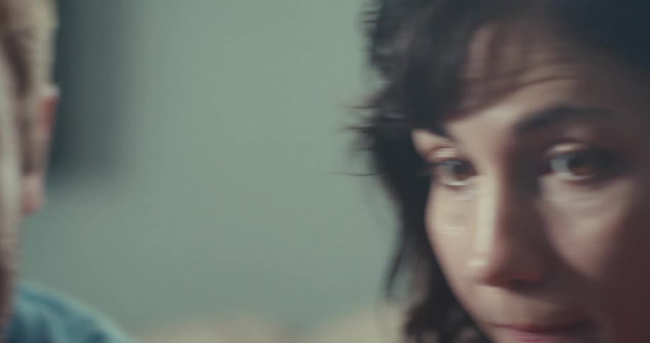 A man and a woman looking at something and talking