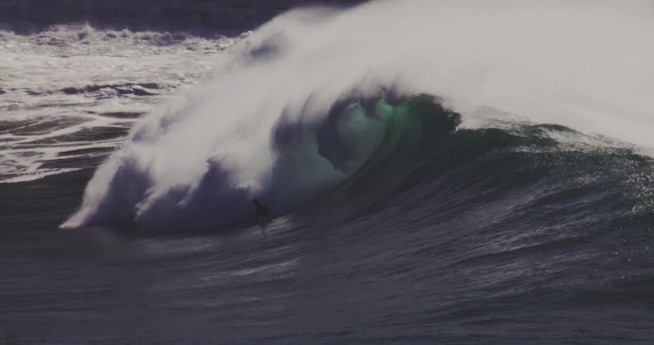 A group of people surfed the ocean waves at midday