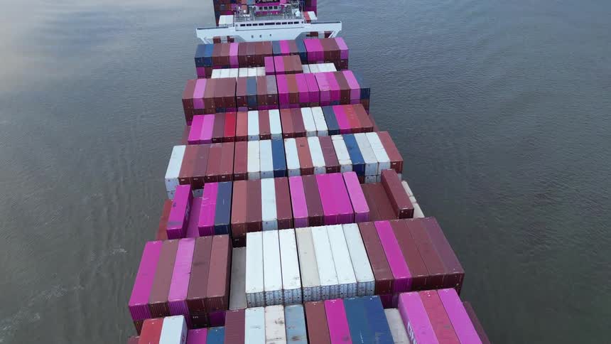 Flying over a large shipping barge in a river