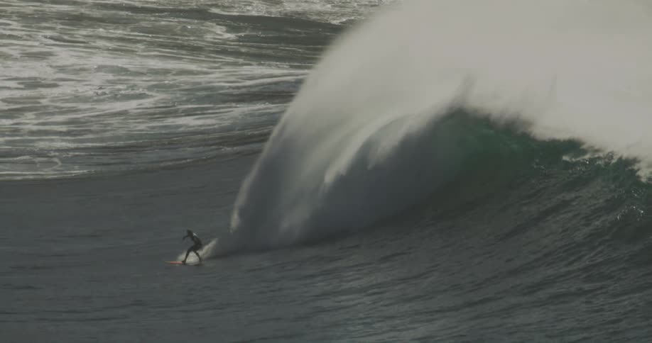 A surfer catching a big wave