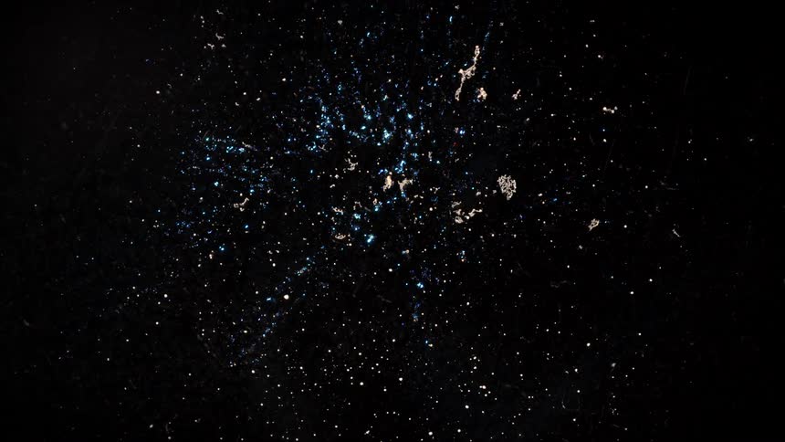 A close up of some colorful particles