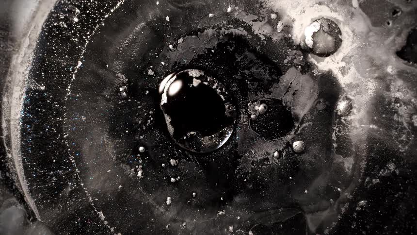 A liquid in a circular pattern dries up on a surface