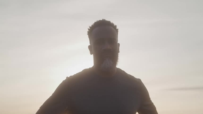Bearded man and outdoor setting at dawn