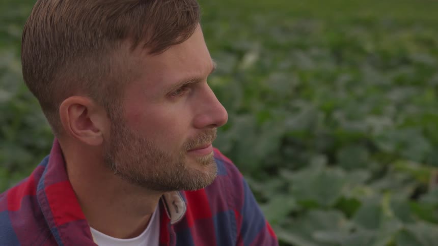 A man outside with his crops
