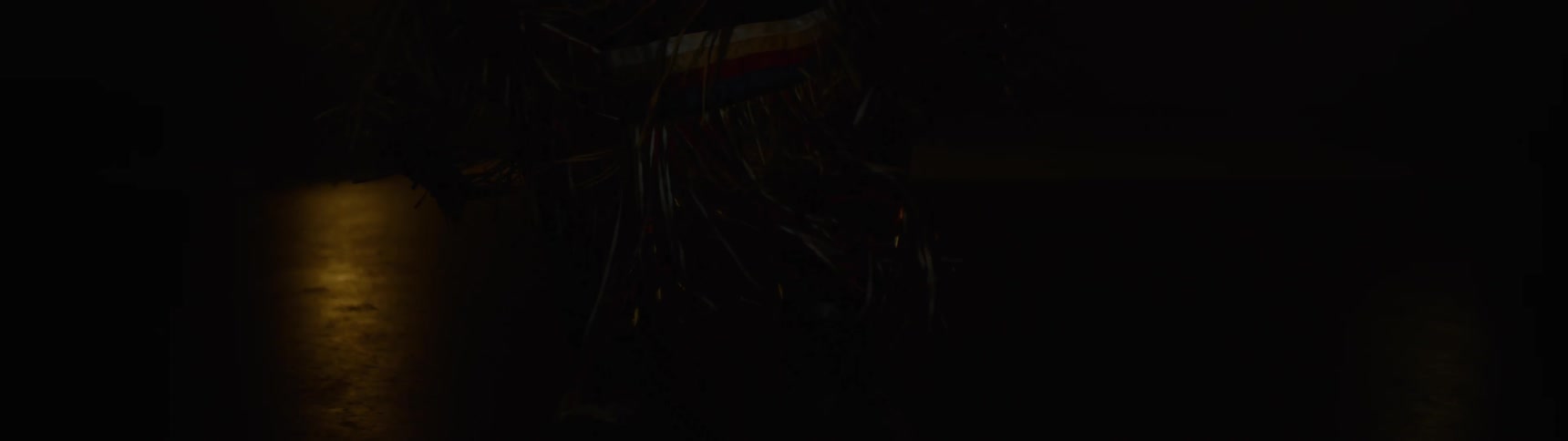 A person is dancing on the dark stage