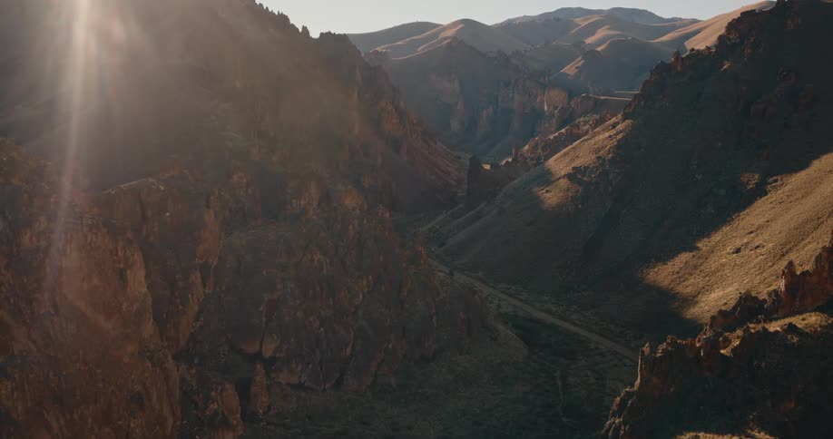 A trail runs through the mountains