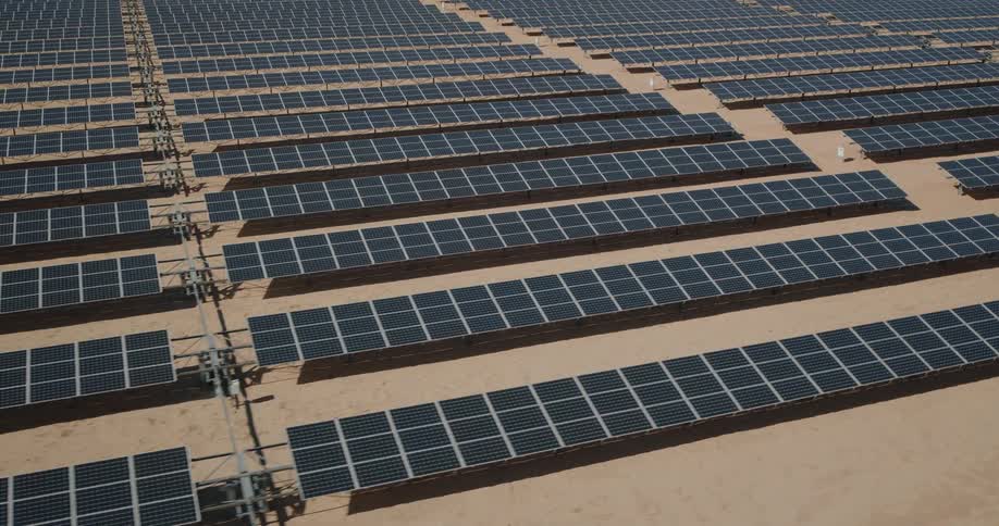 Aerial view of an outdoor field filled with solar panels