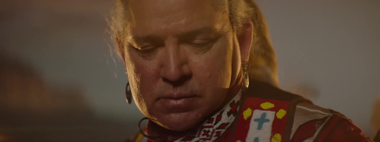 Portrait of a man in traditional indigenous clothing