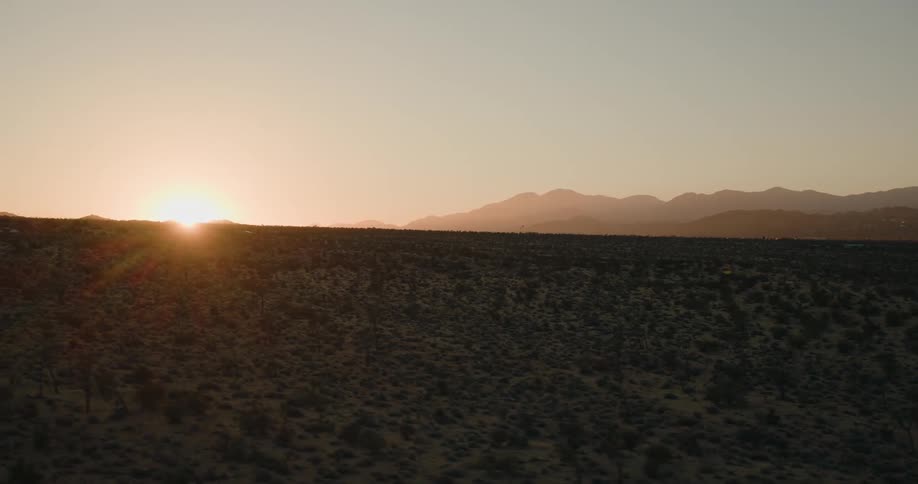 The sun setting over a desert