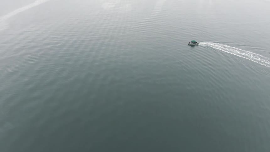 Aerial view of a boat sailing at sea