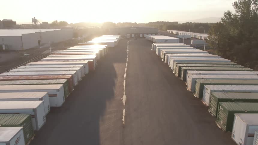 The lot is filled with shipping containers