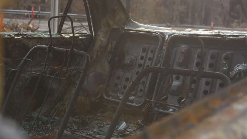 Car destroyed and burned in the open air