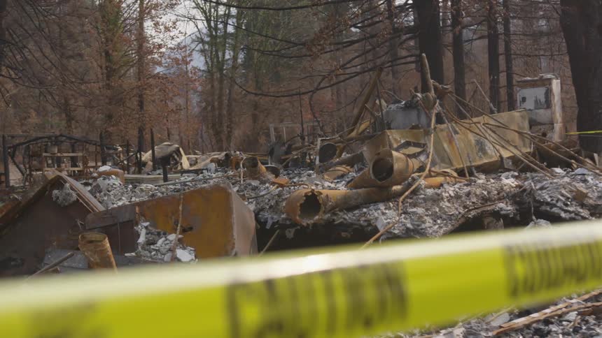 The disaster site is full of ash and debris