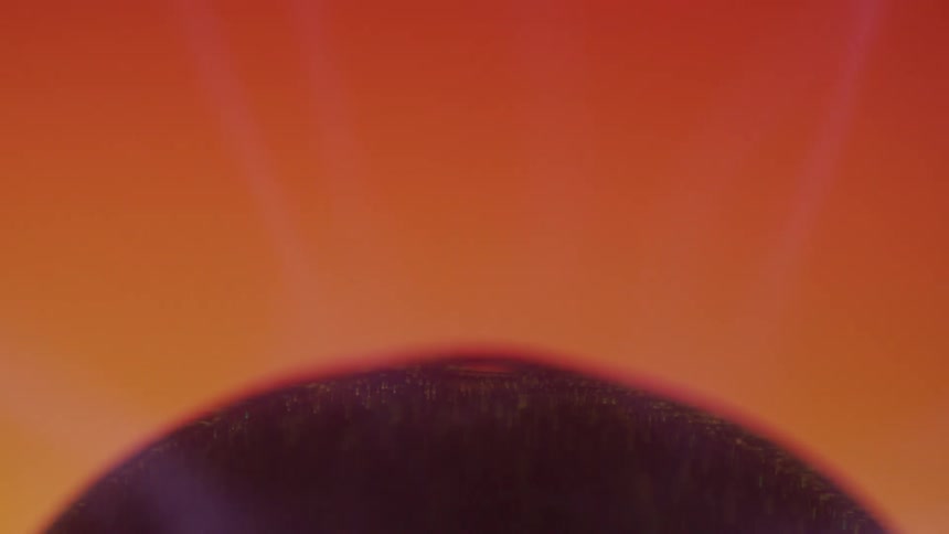 Abstract closeup of a nucleus emitting purple magnetic waves