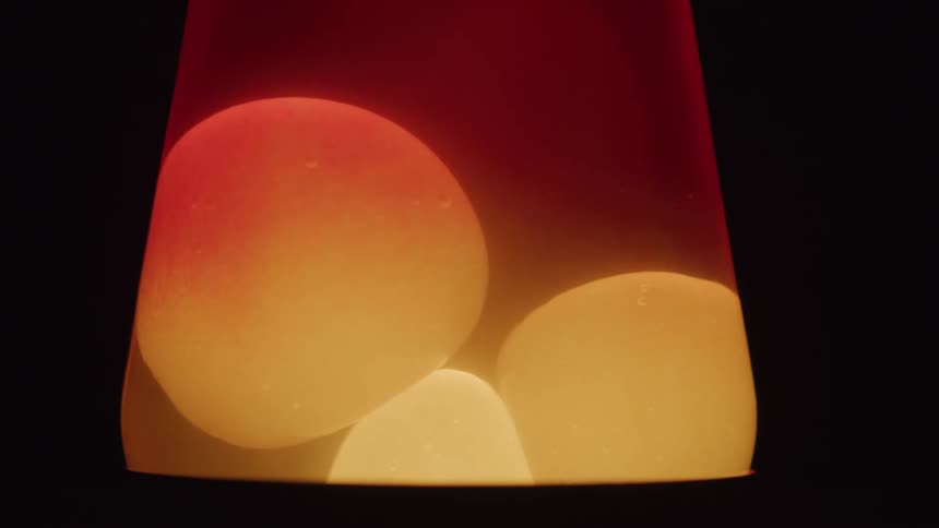 Close up of a lit lamp against a dark background