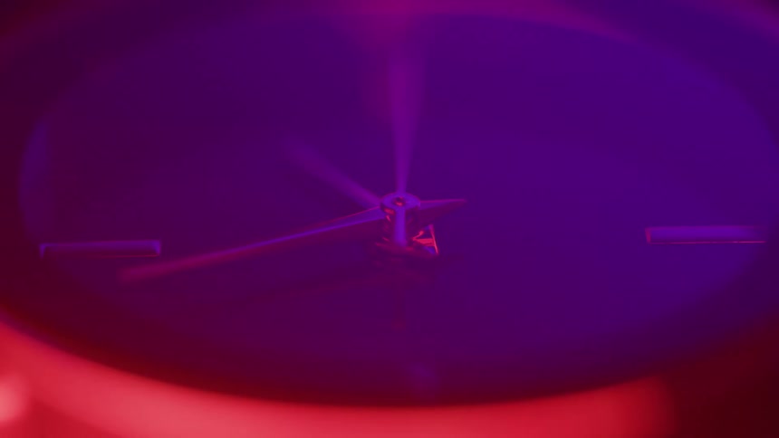 A clock under purple light