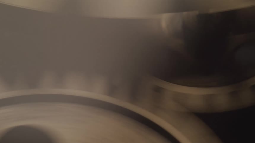 Metal gears of a moving clock