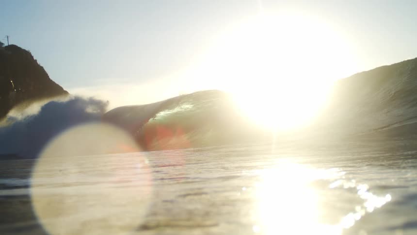 A wave rolls down the shore