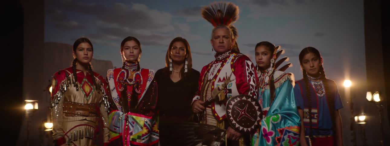 Group of people of different ages dressed in traditional indigenous costume