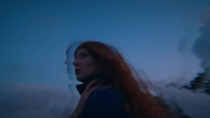 Redhead woman outdoors at night