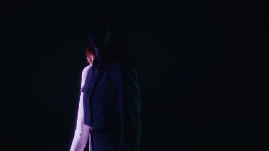 Silhouette of a model in a lowlight environment