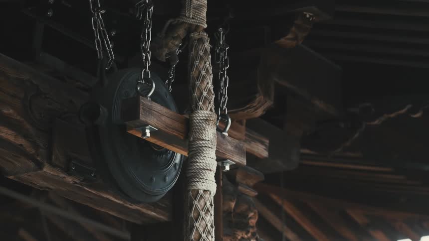Rope and chains hang in the barn