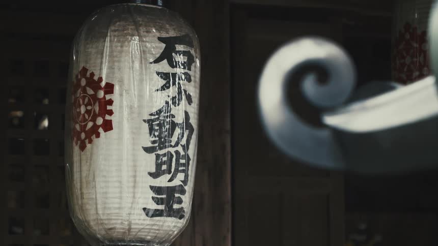 A lantern is hanging in front of the door