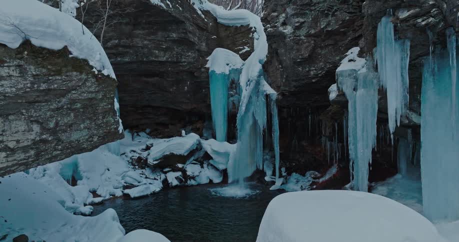 A small waterfall in a frozen forest