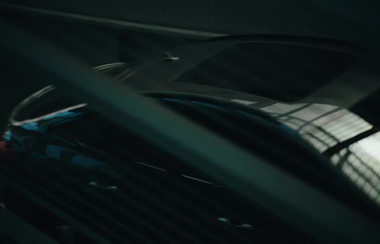 The car is driving to park in the parking garage