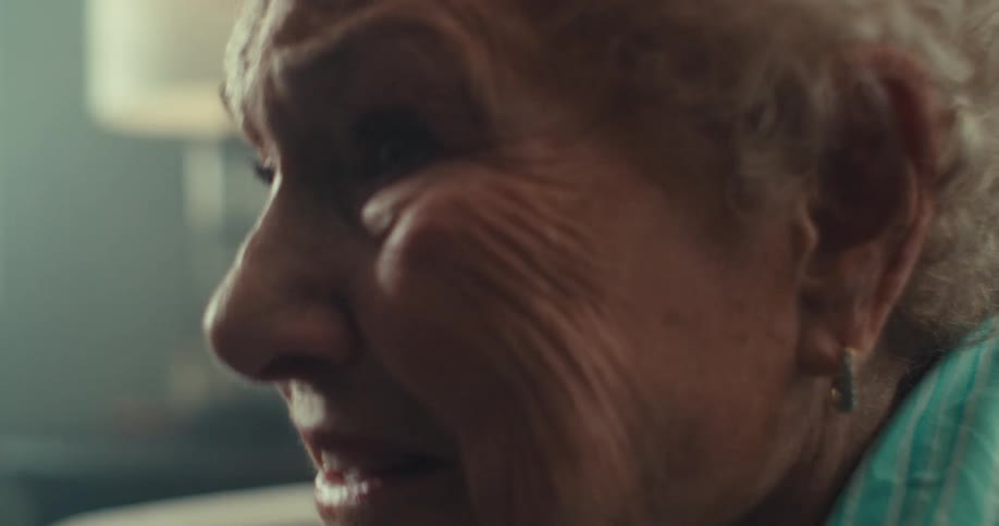 A woman looks scared as she talks