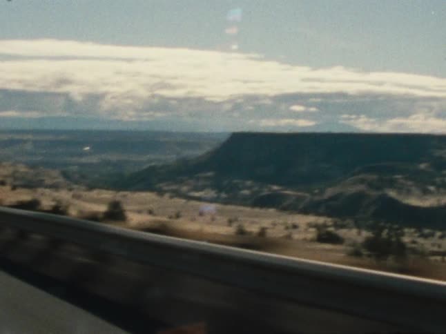 Driving past a large canyon