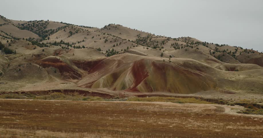 A long flat field is before the mountains