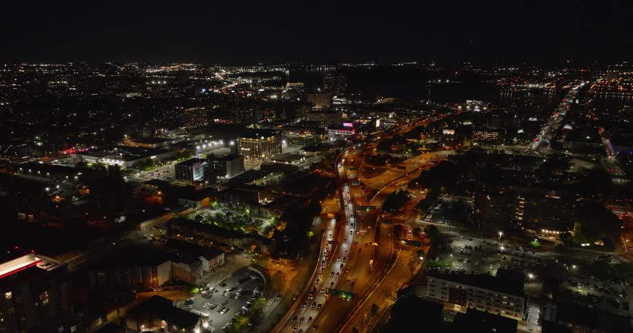 Aerial of congested traffic driving Philadelphia highway at night