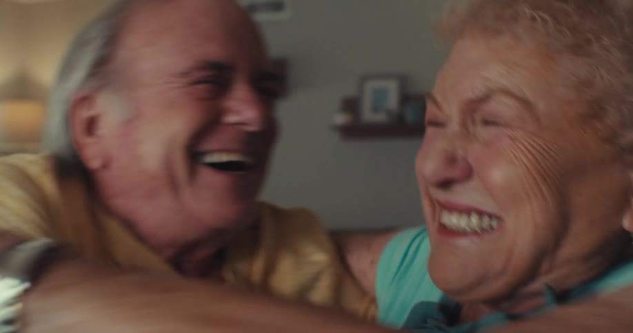 Elderly couple talking happily