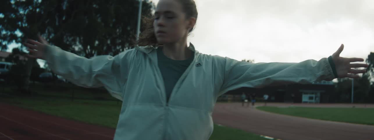 She is stretching on the track