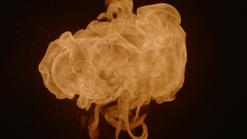 A flame burns and floats upwards
