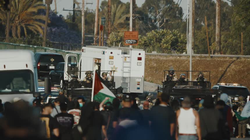 The police set up a barrier to block the protesters