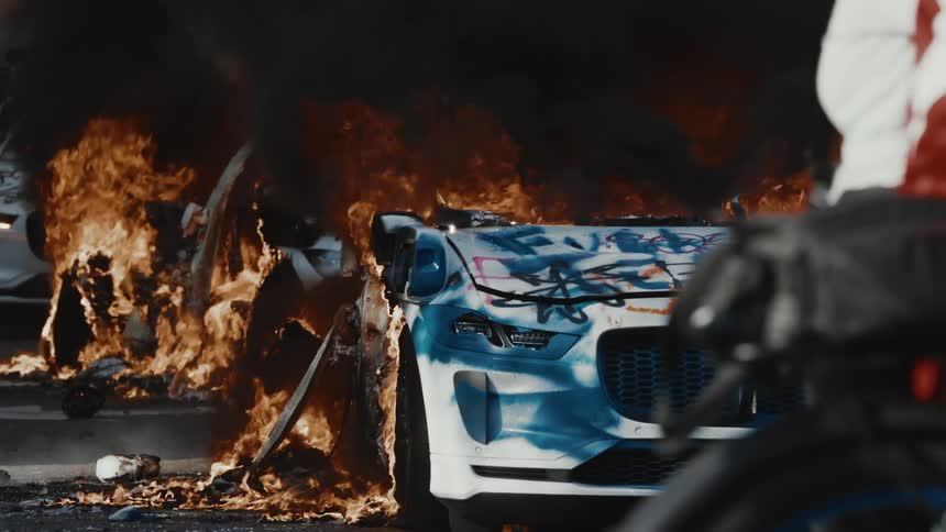 Multiple vehicles are burning up during the riot