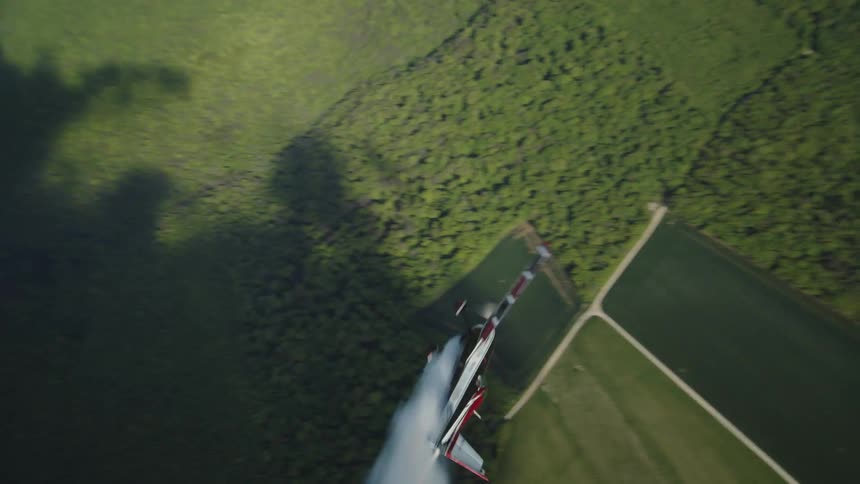 A biplane does aerial tricks